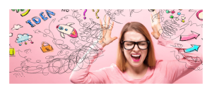 Woman on a pink background with hands in air wearing black rimmed glasses looking overwhelmed