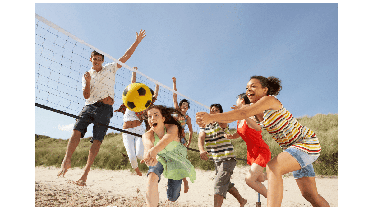 Tween girls playing beach volleyball — summer activities for daughters aged 12–14
